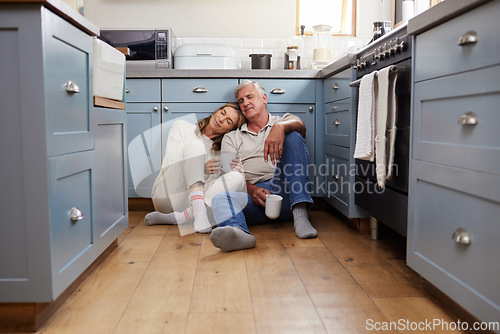 Image of Coffee breakfast, relax and senior couple with smile on the kitchen floor in the morning in their house. Calm elderly man and woman in retirement talking with tea and love in marriage in home