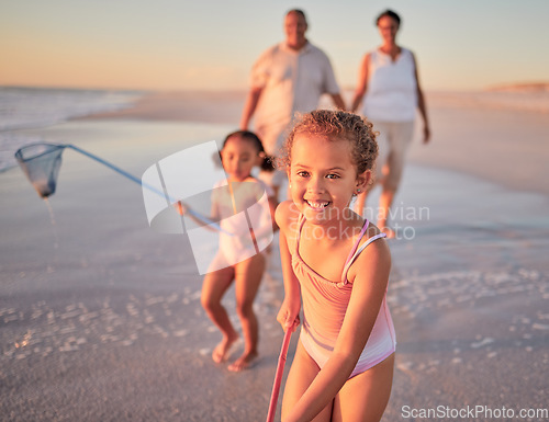 Image of Children, fishing and family with a girl at the beach with her grandparents and sister for summer holiday. Kids, happy and ocean with a child on sand by the sea with her grandmother and grandfather