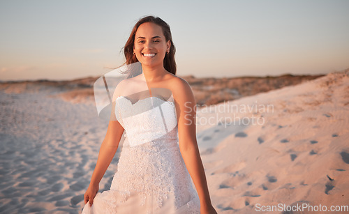 Image of Beach, wedding and portrait of a happy bride standing outdoor in nature at a marriage ceremony. Romantic, sunset and beautiful married woman with a smile by the ocean or seaside in puerto rico.