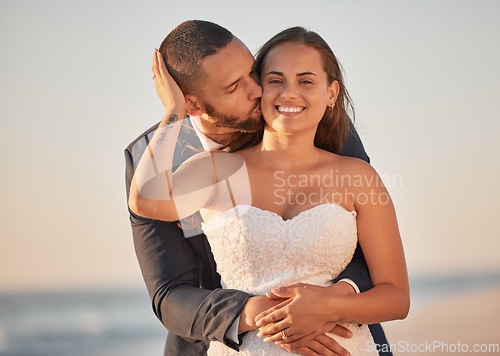 Image of Love, wedding and couple on beach together hug and bonding while celebrating their marriage in nature. Portrait, bride and groom embrace on ocean trip in Brazil, just married happy and relax by sea