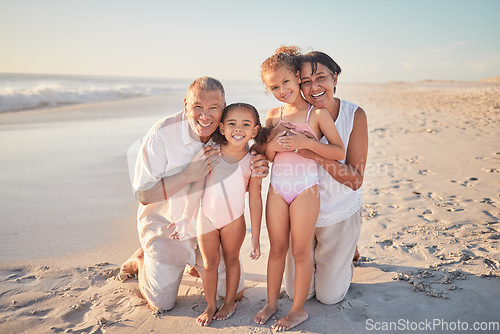 Image of Grandparents with children, happy on beach on holiday and enjoying retirement. Grandpa, grandma and kids enjoy afternoon playing in ocean summer sun. Family love time together by the sea and sand