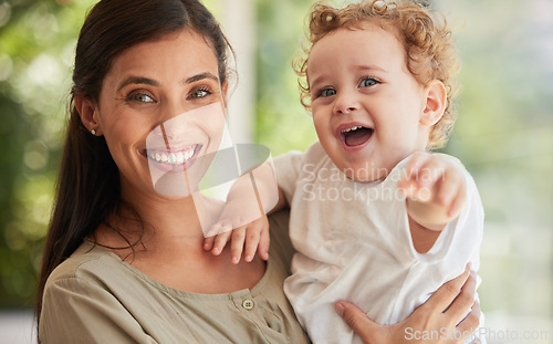 Image of Family, baby and love with a mother and son in their home with a smile and feeling happy or excited together. Portrait, children and cute with a woman and her adopted boy child bonding in their house