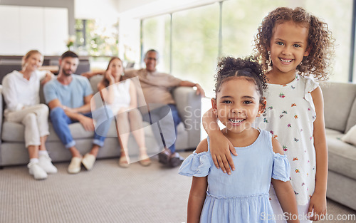Image of Girl, kids and smile in home living room on holiday together with parents blurred in family portrait. Friends, cousin and family in lounge happy embrace with mother and dad on sofa behind in Toronto