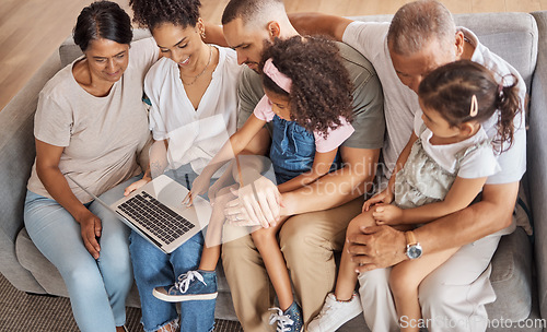 Image of Top view, laptop and family watch cartoon movies or streaming online in the living room on a sofa. Diverse senior people, with parents and grandchildren on couch in family home enjoy slideshow.