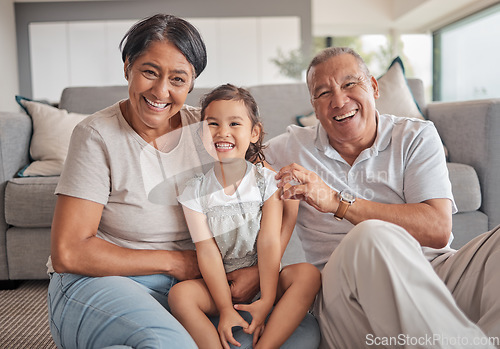 Image of Grandparents, girl and floor in house, smile and playing while in bonding together. Grandmother, grandpa and child on carpet in living room, smile and family home, for visit or holiday in Jakarta