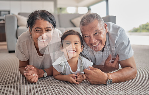 Image of Relax, happy and grandparents with girl in living room with family from Indonesia for lifestyle, love and retirement. Care, smile and portrait of elderly man and old woman with child at home together