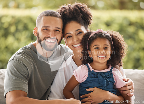 Image of Happy family, mother and father with their child love being home for bonding, quality time and relaxing together. Smile, mom and dad enjoy hugging and connecting with their young girl on the weekend