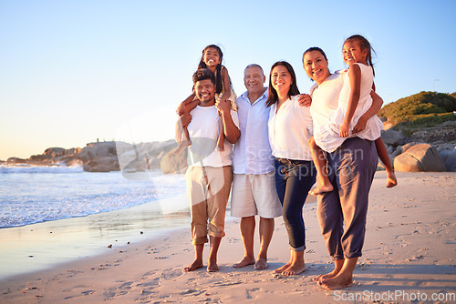 Image of Travel, portrait and family at the beach at sunset, happy and relax while walking and bonding at the ocean together. Wellness, freedom and happy family enjoying a calm, relax walk on sea sand