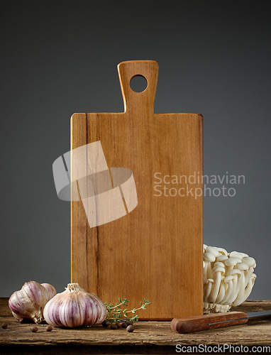 Image of still life with cutting board and vegetables