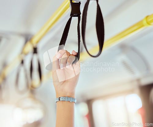 Image of Public transport hands, safety handle and railing loop on bus, train and urban metro subway. Closeup woman traveler grab handrail support, handle and transportation ring in crowded cabin for journey