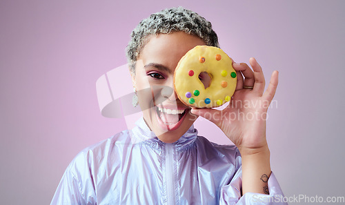 Image of Black woman, donut and fashion excited and happy peeking through dessert with futuristic vaporwave and holographic style and purple background. Face portrait of cool and trendy African female model