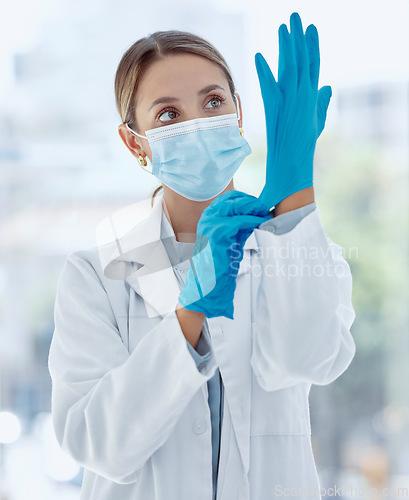 Image of Doctor mask, covid gloves and woman ready for operation, surgery or examination. Health, healthcare and medical female professional safety ppe, corona virus or bacteria, germs and disease prevention