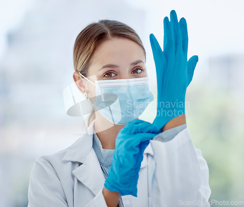 Image of Covid woman doctor, face mask and gloves safety, medicine and risk in medical hospital, laboratory and clinic. Portrait corona virus nurse, healthcare expert and professional therapist ready in ppe