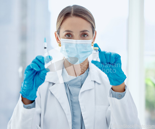 Image of Doctor, mask and needle with vaccine for covid in bottle at hospital, for health and community safety. Woman, medic and injection in lab to research for stop coronavirus, syringe, medicine or cure