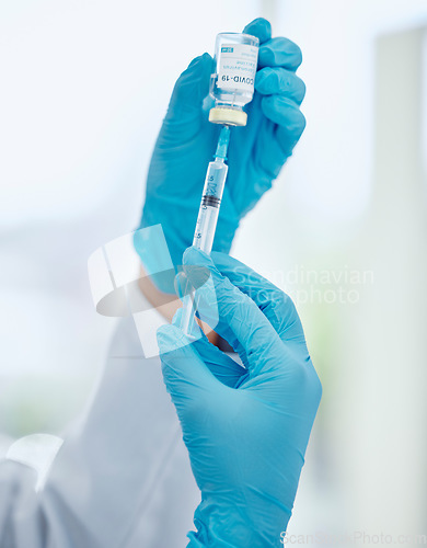 Image of Covid, medicine and vaccine with hands of doctor holding syringe and glass vial for healthcare, pharmacy and science. Innovation, medical and research with pharmacist working on treatment for virus
