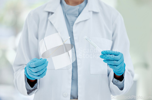 Image of Healthcare, hand and doctor with covid test in a hospital, hands holding pcr test and swab. Research, health and innovation closeup of nurse doing analysis of corona testing results medical sample