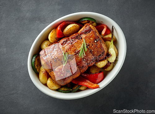 Image of whole roast pork and vegetables