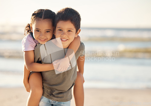 Image of Portrait of boy and girl at the beach during family summer vacation during sunset. Happy children or sibling hug, play and smile at the ocean or sea with freedom, care and smile on nature holiday