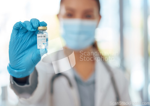 Image of Doctor hands, covid vaccine medicine bottle and serum for risk, healthcare and wellness safety. Closeup corona virus medical development, pharmaceutical innovation and covid 19 science drug test cure