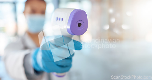 Image of Covid, nurse hand and health thermometer scan check at a hospital, healthcare or clinic from a doctor. Woman working with medical temperature measure to see fever for disease, dengue fever or corona