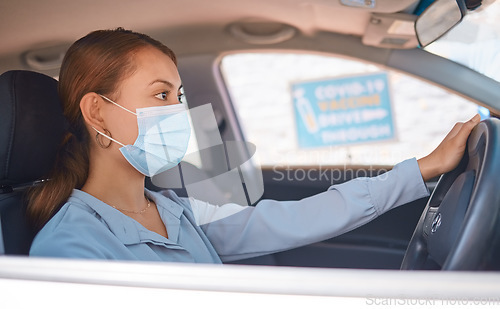 Image of Covid vaccine, car drive and woman with face mask for safety, compliance and healthcare at an outdoor clinic or hospital. Person in vehicle at covid 19 drive thru for corona virus medical vaccination