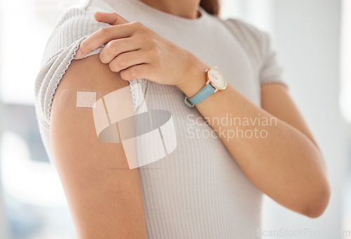 Image of Covid, vaccine and woman with plaster on arm, medical shoulder injection dose and immunization bandage. Corona virus immunity, immune system cure or wellness and female patient healthcare vaccination