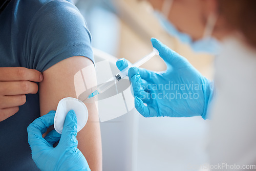 Image of Medicine, health and patient with a covid vaccine from a doctor at a hospital during a pandemic. Closeup of a healthcare worker doing a medical antibody treatment injection at a medicare clinic.