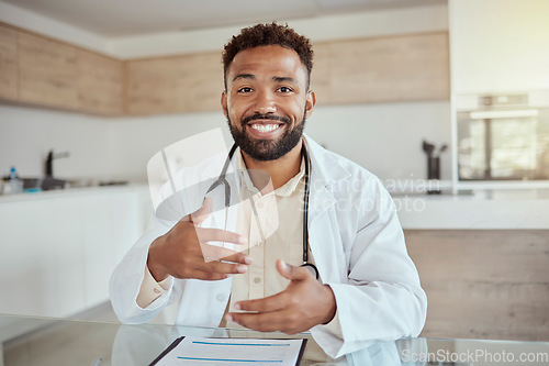 Image of Happy medical doctor on video call, home desk in online healthcare and portrait of black man smile in digital consultation. Physician on virtual telehealth appointment, tech service and talking pov