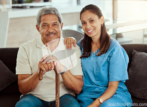 Image of Nurse, portrait and senior man bonding, sitting on sofa during a checkup at assisted living facility. Elderly care, support and nursing with young woman caregiver help, retirement and treatment