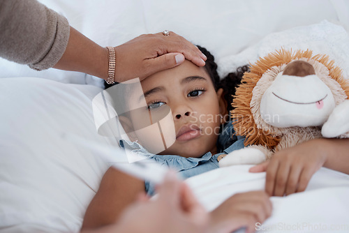 Image of Sick child, covid and medical emergency in bed of home, healthcare problem in bedroom of house and mother with thermometer for fever. Mom care for sad girl with virus, cold or flu in apartment