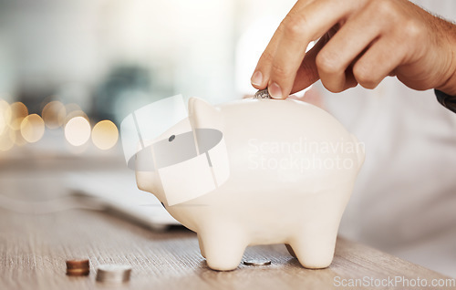 Image of Piggy bank savings, investment and hand with money, coin or silver investing in future wealth, financial growth or economy wealth. Accounting man saving change or cash for profit, finance and budget