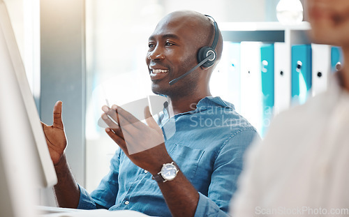 Image of Customer service, consultant and contact us for our call center employees to support in helping you with a loan. African Fintech insurance agent working at a computer desk happy to give you advice