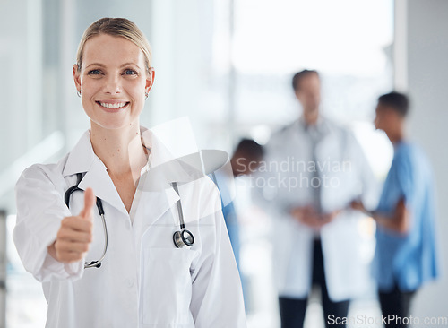 Image of Thumbs up, smile and happy doctor, woman or success in a medical hospital. Portrait like gesture or vote hands, okay or success, welcome or motivation, hand communication, icon or thank you sign.