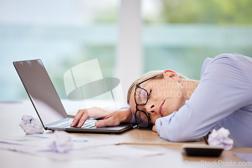 Image of Business woman sleeping at laptop desk, burnout stress from fatigue and insomnia problem in workplace career at computer. Office worker tired, risk job loss and overworked person nap at tech company