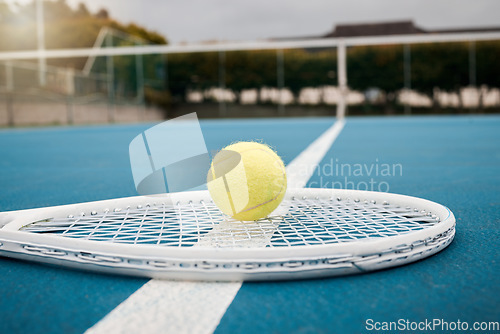 Image of Tennis and ball with racket with equipment on sports court for fitness, exercise and recreation. Health, competition and training for a tournament match or game. Hobby, objects and healthy lifestyle