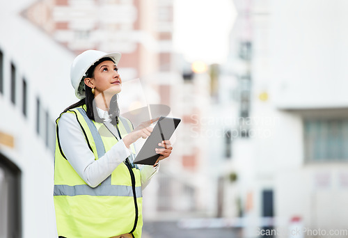 Image of Woman, building manager and construction on tablet doing inspection and working on site in the city. Female architect or builder contractor checking architecture at work on touchscreen technology