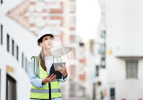 Image of Woman, building and construction inspection on tablet working on site in the city for industry. Female architect, builder or contractor checking architecture detail at work on touchscreen technology