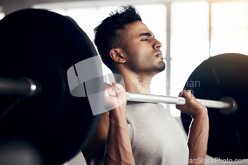 Image of Barbell exercise, focus and gym man workout, training and fitness of heavy weights, strong mindset and motivation. Indian bodybuilder, male athlete and muscle energy, power challenge and healthy body