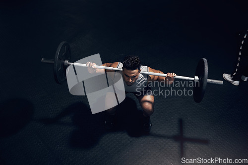 Image of Barbell squat, dark gym and man sports training, workout and fitness of heavy weightlifting in health club. Above of indian bodybuilder, athlete and body exercise, muscle power and strong motivation