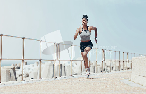 Image of Running, black woman and beach marathon training, fitness and wellness for sports goals, body motivation and energy outdoors. Focus, speed and cardio runner athlete, ocean exercise and summer workout