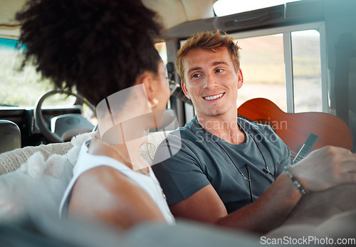 Image of Camper, van and couple relax while travel, happy, talking and bonding in their vehicle together. Love, freedom and content woman and man enjoying their journey and vacation exploring and having fun