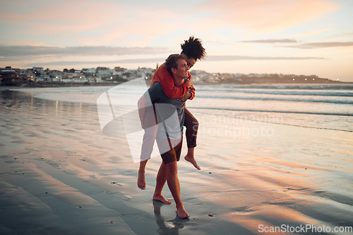 Image of Love, travel and couple walking along the beach at sunset, bond and having fun in nature together. Freedom, carry and man and woman enjoying a romantic ocean holiday in Los angeles, cheerful and calm