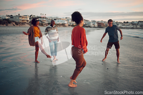 Image of Water, feet and friends at a beach at sunset, celebrating their freedom and friendship while bonding in nature. Travel, fun and diverse people laughing and being silly together in Los Angeles ocean