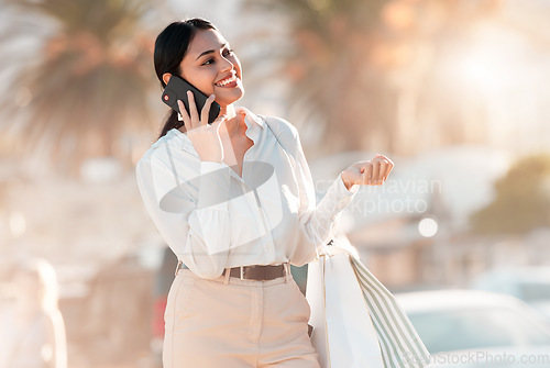 Image of Woman, phone and smile for call while shopping on street in city for discount, luxury and sale. Girl, smartphone and happiness on face with fashion, retail and happy in summer in Los Angeles with bag