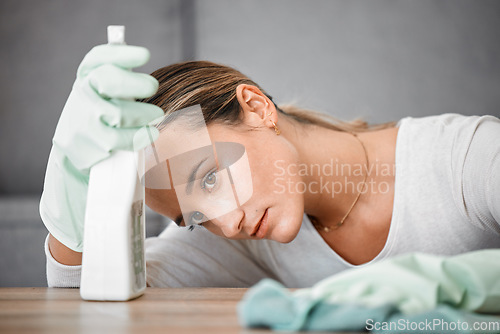 Image of Spring cleaning house, tired and sad woman in home living room with burnout, stress and frustrated spray task. Bored, thinking and depression chores, housekeeping cleaner and exhausted maid service