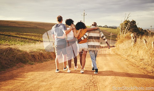 Image of Friends, hug and vacation in the countryside for holiday travel enjoying time together in nature. People in friendship support, care and love hugging on a dirt road walking in South Africa