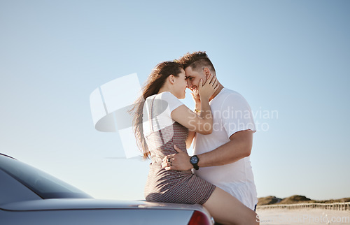 Image of Love, relax and couple embrace at car for intimate driving break together in Los Angeles, USA. Young, happy and caring people enjoy summer sunshine with romantic touch while leaning on vehicle.