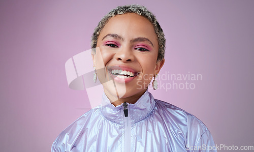 Image of Happy black woman, neon fashion and portrait of creative, cyberpunk and retro, bold and colorful makeup, clothes and cosmetics on studio background. Unique, vaporwave and smile gen z model influencer