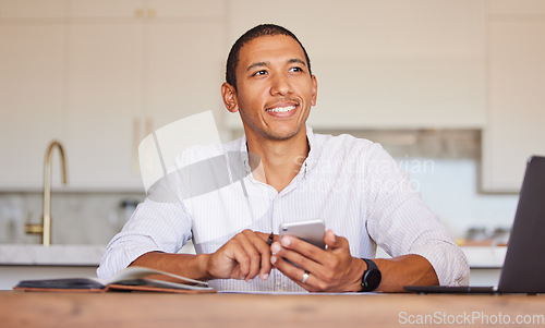 Image of Man, smile and phone at table thinking for remote work, communication or trading on internet. Smartphone, businessman and focus for idea in kitchen while typing text on app, chat or web in home