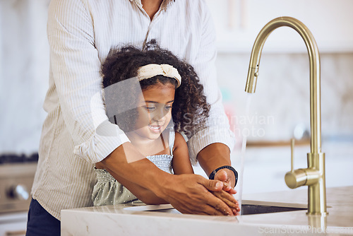 Image of Girl, hands and dad for washing, cleaning and hygiene in kitchen in house. Child, water and father together learning to wash hand to stop germs, bacteria and virus for health, wellness and care